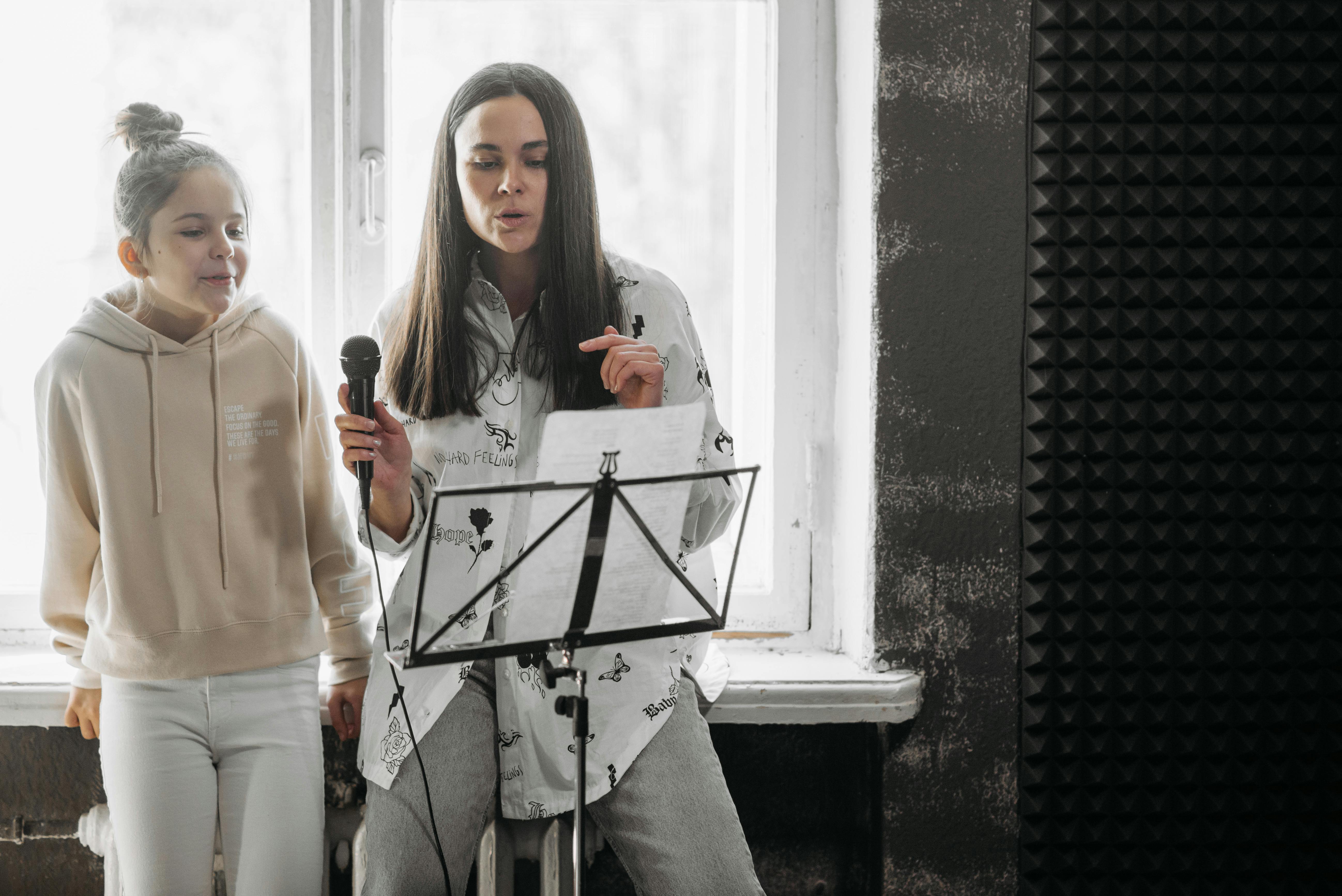 A voice teacher and student working together